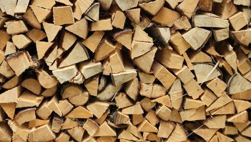 Split firewood heap stacked chopped timber wood